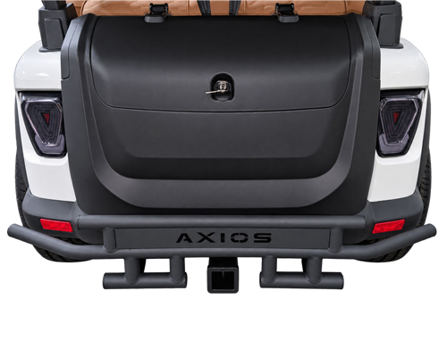 Rear view of a white SUV with a large black spare-tire cover and rugged bumper featuring a tow hitch and dual steps.